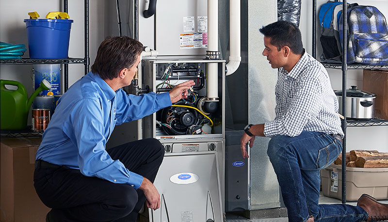 HVAC technician evaluating a furnace for repair or replacement in Prescott Valley