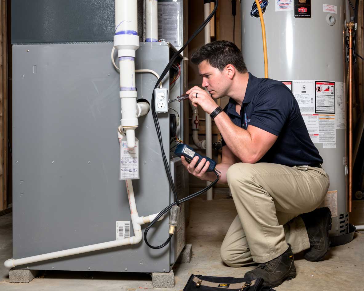 HVAC technician performing a furnace tune-up in Prescott Valley